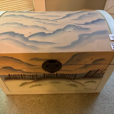 Hand-painted domed wooden storage chest featuring a coastal beach scene with dunes and seagulls, complete with a metal latch closure.