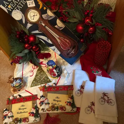 Collection of holiday decor items including a boxed La Crosse Weather Station, Christmas-themed picture frames, embroidered hand towels,...
