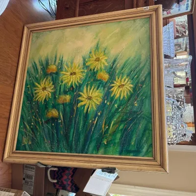 Framed impasto oil painting depicting yellow daisies in a field, housed in a painted wooden frame, mid-to-late 20th century.