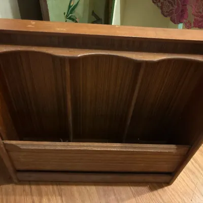 Vintage wood magazine rack with a three-section divided compartment, showing light surface wear.