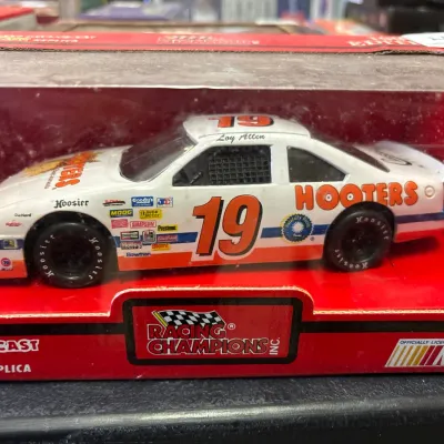 Racing Champions 1:24 scale die-cast replica of Loy Allen's No. 19 Hooters Ford stock car, in original packaging.