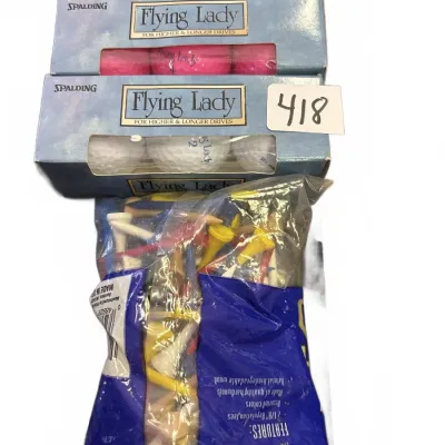 Three sleeves of vintage Spalding Flying Lady golf balls in light blue, pink, and white, paired with a large bag of assorted colorful...