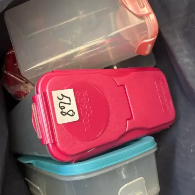 Collection of LocknLock clear plastic food storage containers with colorful locking lids.