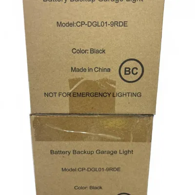 Two boxed Battery Backup Garage Lights in black, model CP-DGL01-9RDE, appearing new in cardboard packaging.