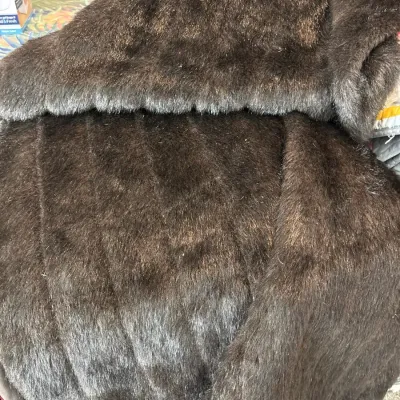 Plush dark brown faux fur blanket with a soft texture and subtle sheen.