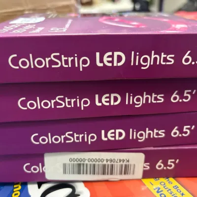 Stack of four boxed ColorStrip 6.5-foot LED light strips in original purple packaging.