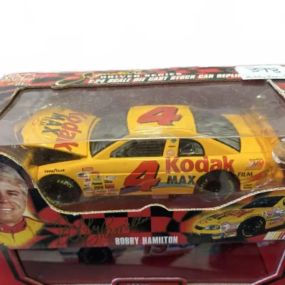 Racing Champions Signature Driver Series 1:24 scale die-cast stock car replica featuring Bobby Hamilton's #4 Kodak MAX Film car, in...