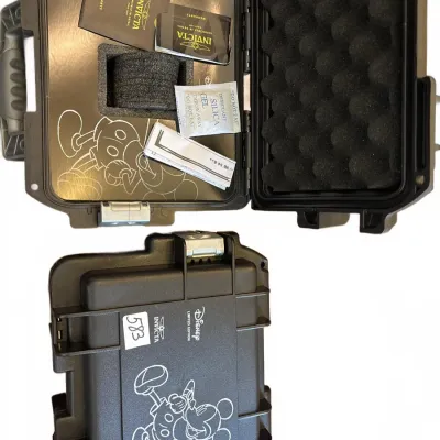 Invicta Disney Limited Edition hard-shell single watch collector case with original warranty paperwork and accessories.