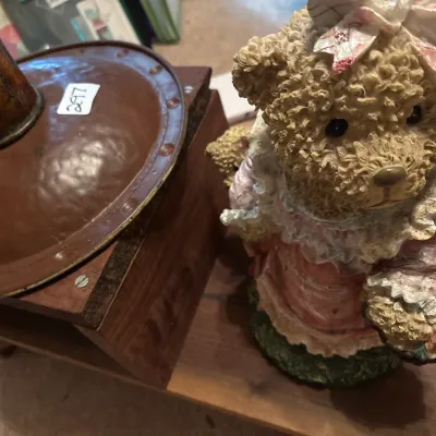 Boyds Bears textured resin teddy bear figurine alongside a rustic wooden table lamp with a hammered metal base.
