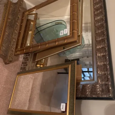 Collection of framed wall mirrors in ornate giltwood and faux-bamboo gold-toned finishes.