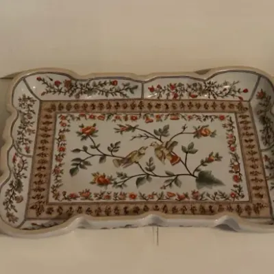 Set of three vintage ceramic trays and plates, featuring floral and bird motifs in Asian and traditional styles.