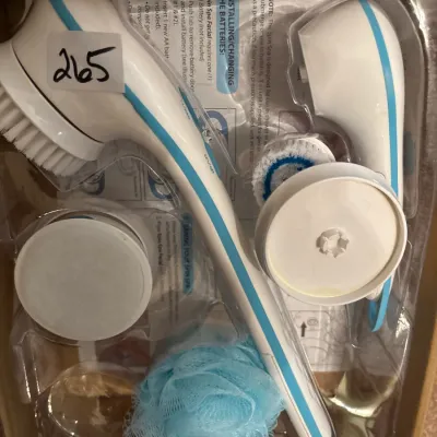 Spin Spa body and facial cleansing brush set in original packaging with attachments.