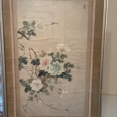 Framed Asian floral watercolor painting on paper with silk matting and decorative braided border, featuring soft pink and white roses.