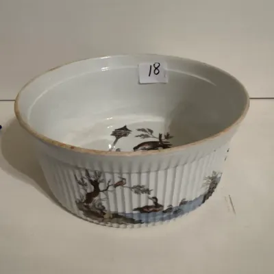Vintage fluted ceramic soufflé dish or mixing bowl featuring an illustrated scene of birds and trees on the interior and exterior.