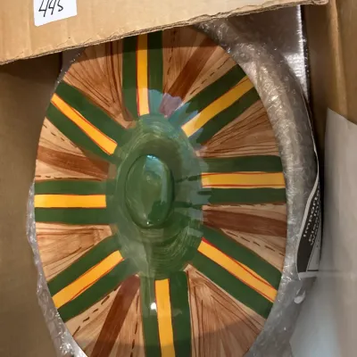 Hand-painted ceramic oval lid with green, yellow, and brown striped pattern, packed in bubble wrap inside a cardboard box with lot number...
