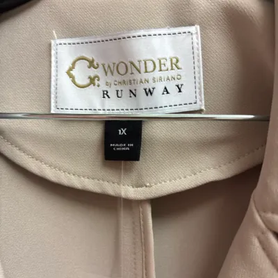 C. Wonder by Christian Siriano Runway beige garment label, size 1X.