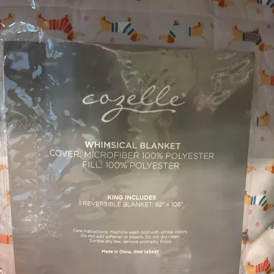 Cozelle king-size reversible blanket featuring a whimsical dachshund pattern, new in original packaging.