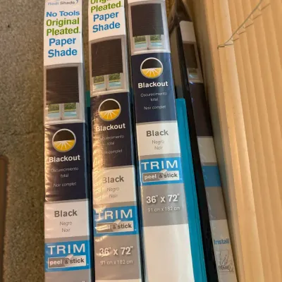 Set of four Redi Shade blackout pleated paper shades in original retail packaging, size 36 inches by 72 inches.