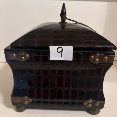 Faux-crocodile embossed dark leather trinket box featuring brass hardware accents and a finial lid top.