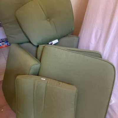 Set of olive green outdoor patio cushions in various shapes and sizes, appearing in good condition.