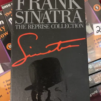 Frank Sinatra The Reprise Collection boxed music set, featuring a black textured slipcase with red printed signature.