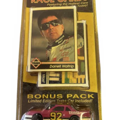 Unopened 1990s Traks bonus pack containing 35 racing cards featuring Darrell Waltrip and a limited edition #92 die-cast stock car.