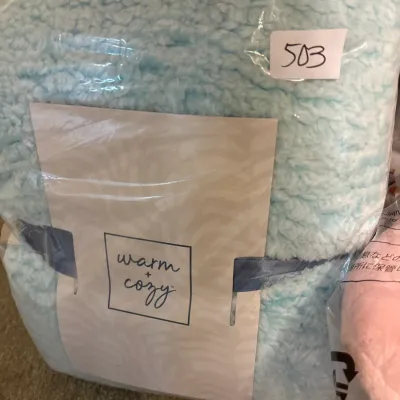 Warm + Cozy light blue sherpa fleece throw blanket, new in original plastic packaging.