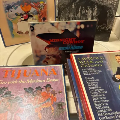 Collection of vintage 12-inch vinyl LP record albums, including Cat Stevens' Tea for the Tillerman and Aerosmith's Night in the...