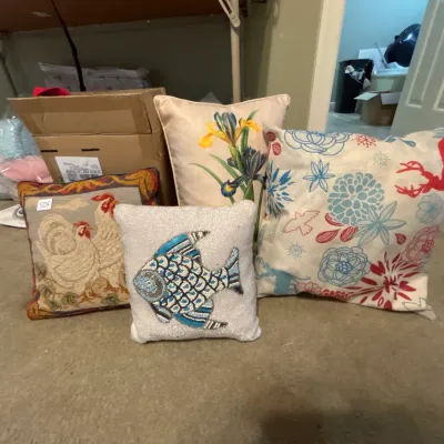 Collection of decorative throw pillows, including a beaded fish pillow, a tapestry rooster pillow, a floral iris pillow, and a printed...