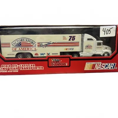 Racing Champions 1:64 scale die-cast Factory Stores of America racing team transporter, 1994 edition in original packaging.