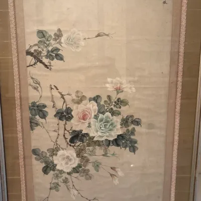 Framed Asian watercolor painting on silk depicting delicate pale roses and foliage, double-matted with a decorative braided border.