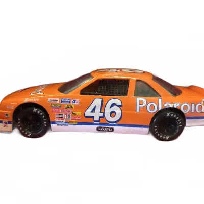 Vintage 1/24 scale orange #46 Polaroid NASCAR die-cast model stock car with Hoosier tires.