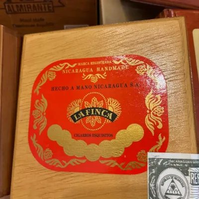 La Finca wooden cigar box featuring a bright red and gold label and an official Nicaraguan government seal.