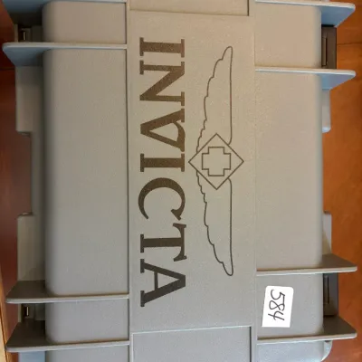 Invicta brand heavy-duty hard plastic watch storage case in grey, featuring a latch closure.