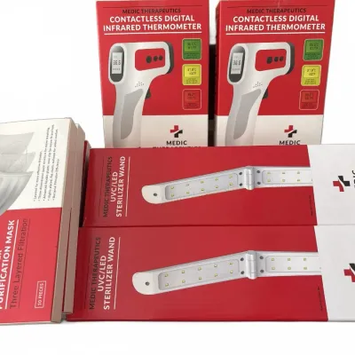 Collection of boxed Medic Therapeutics personal protection and wellness products, including two contactless digital infrared...
