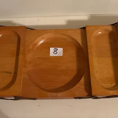 Vintage expandable wooden serving tray with carved compartments and side handles, showing light surface wear.