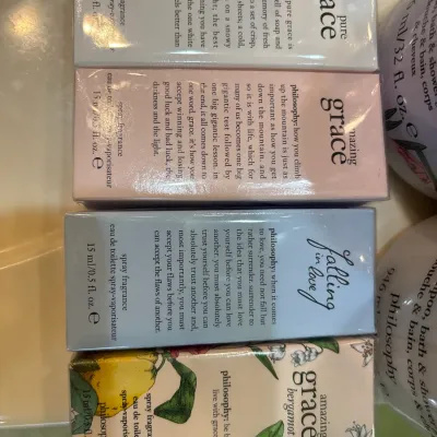 Four boxed Philosophy brand eau de toilette spray fragrances, 0.5 fl oz each, including Pure Grace, Amazing Grace, Falling in Love, and...