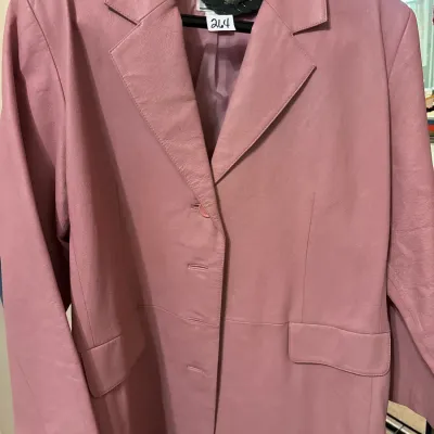 Vintage dusty pink leather blazer jacket with notched lapels and front flap pockets.