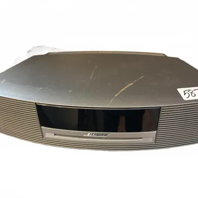 Bose Wave Music System with built-in CD player in graphite gray finish, showing light surface scratches on top.