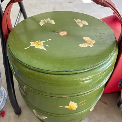 Vintage Asian hand-painted green stackable wedding basket featuring butterfly and floral motifs with a bentwood handle.