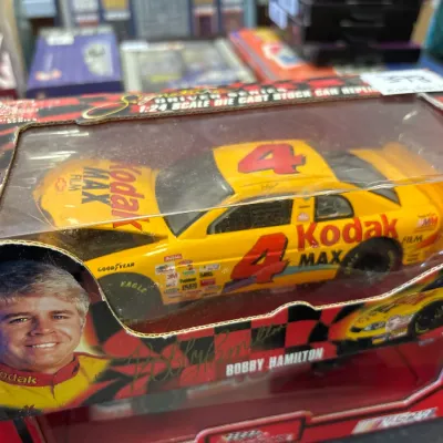 Action Racing 1:24 scale die-cast replica of Bobby Hamilton's #4 Kodak MAX NASCAR stock car in its original display box.