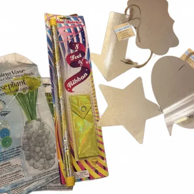 Craft and novelty lot, including packaged Crafter's Square metal shapes with hanging twine, a ribbon twirler wand, and a folding...