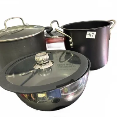 Assorted cookware set including non-stick stockpots with glass lids and a stainless steel bowl.