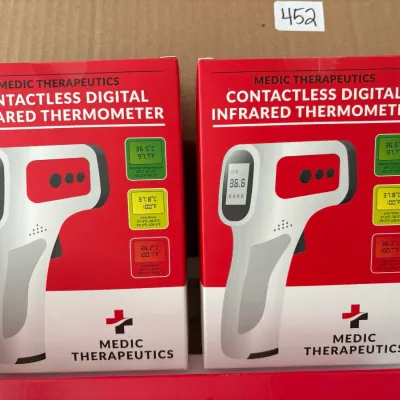 Two boxed Medic Therapeutics contactless digital infrared thermometers in new condition.