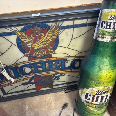 Michelob Light faux stained glass illuminated bar sign alongside a Miller Chill bottle-shaped light.