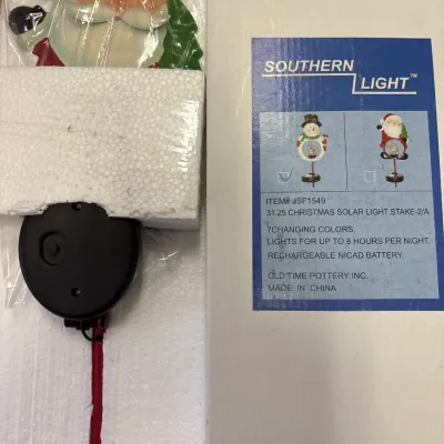 New in box Southern Light 31.25-inch solar Christmas Santa garden stake with color-changing light features.