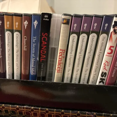 Collection of assorted DVDs, including multiple Great Courses educational series titles, TV shows, and feature films.