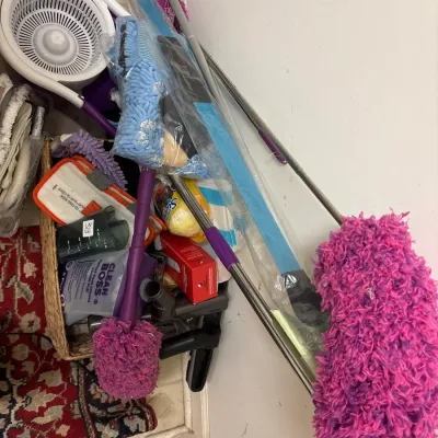 Collection of modern household cleaning tools, including microfiber dusters, flat mops, and spin mop attachments.