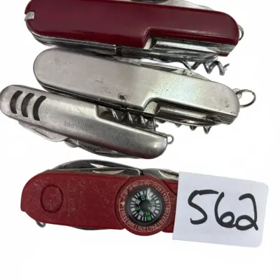 Collection of four vintage multi-tool pocket knives, including red composite and brushed metal styles with corkscrews and an integrated...