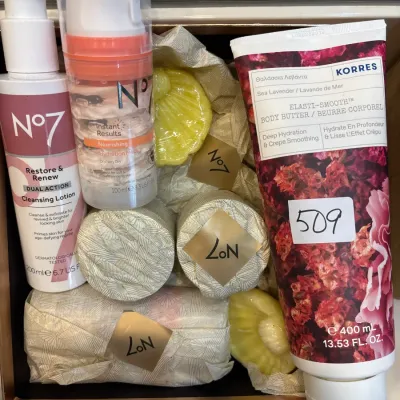Assortment of skincare and bath products, including Korres Sea Lavender body butter and No7 cleansing lotion, hydration mask, and wrapped...